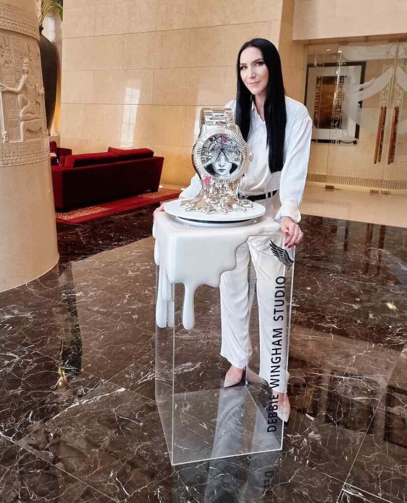 Debbie Wingham with her latest creation - the most expensive time piece installation at Raffles Dubai