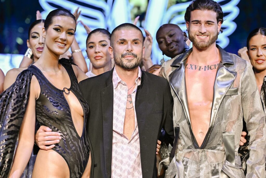the designer Erik Rosete and Briceson Harrell pose at the finale of the runway for the Mister Triple X fashion show during the Miami Swim Week Powered By Art Hearts Fashion at M2 MIAMI on June 01, 2024 in Miami, Florida. (Photo by Arun Nevader/Getty Images for Art Hearts Fashion)