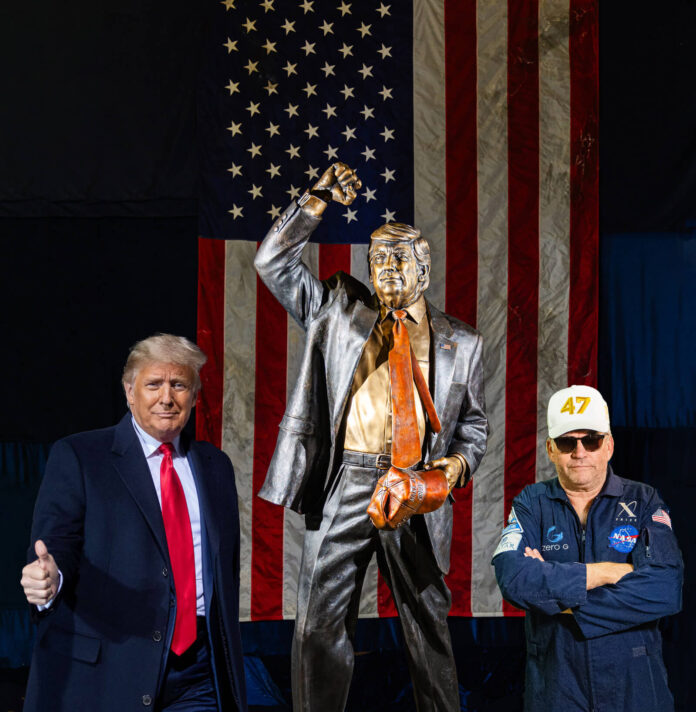 president trump with steven barber and bronze statue of the president in front of american flag