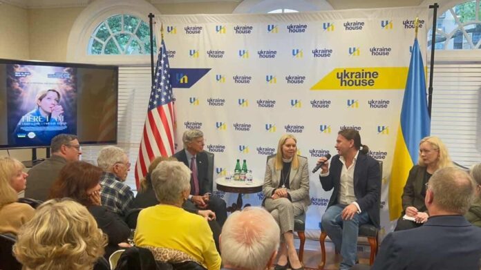 Guests attend the Ukraine House presentation of Here I Am, a Ukrainian short film about faith, loss, and military chaplaincy.